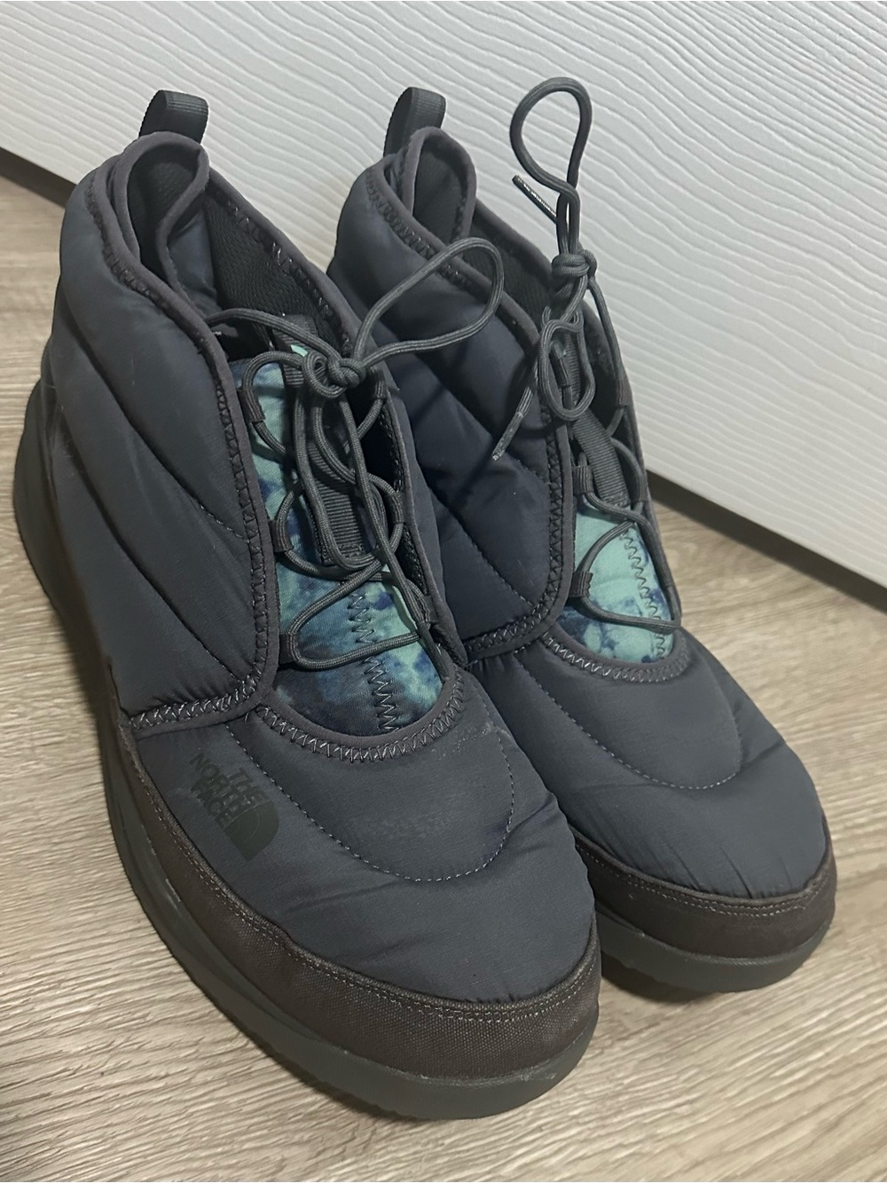 The North Face Black Quilted Slip-On Booties with Teal Accent